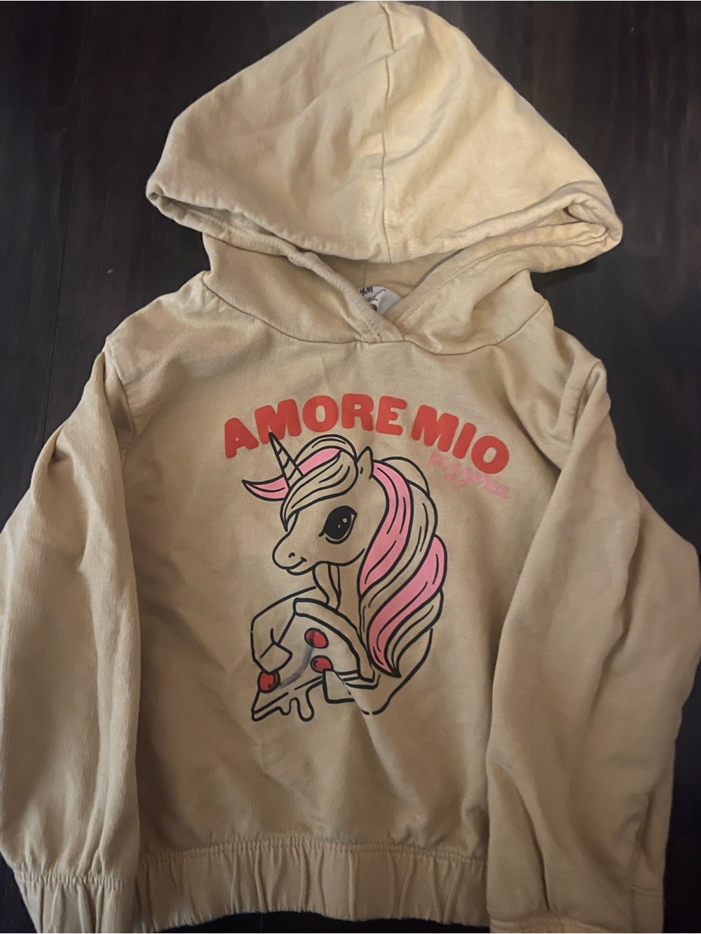 H&M Cream Hoodie with Pink Unicorn Graphic and Red Text